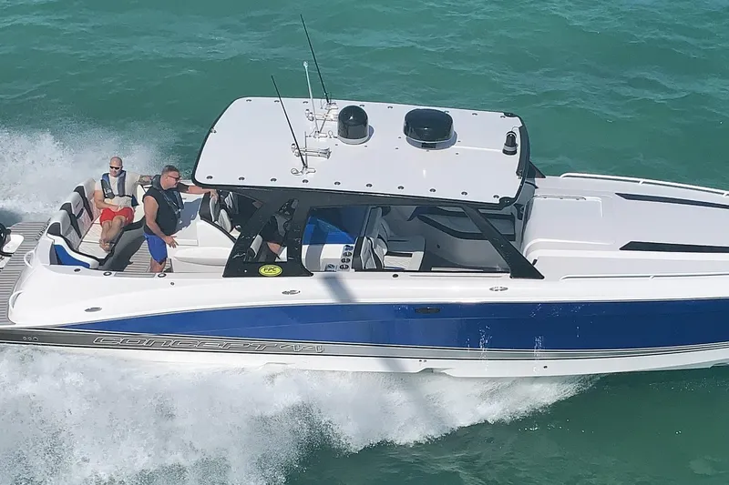 The Image of 2020 Concept 44' Cuddy Cabin boat cruising on turquoise water with passengers onboard. - 1