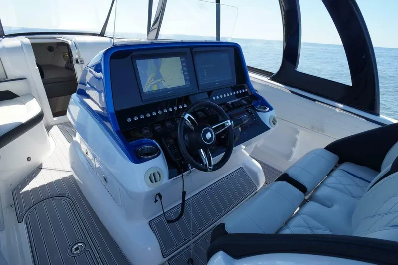 Slide: The Image of Modern helm of 2020 Concept 44' Cuddy Cabin boat with navigation screens. - 12