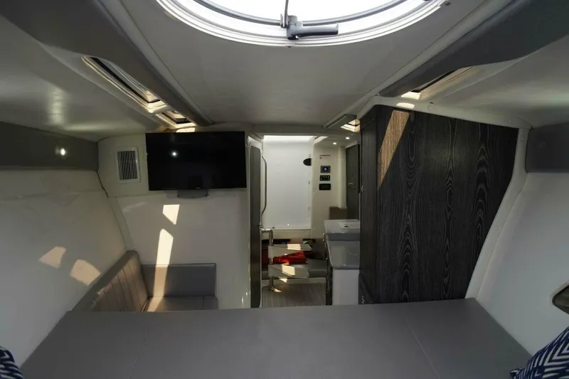Slide: The Image of Interior of 2020 Concept 44' Cuddy Cabin boat with modern amenities and sleek design. - 19