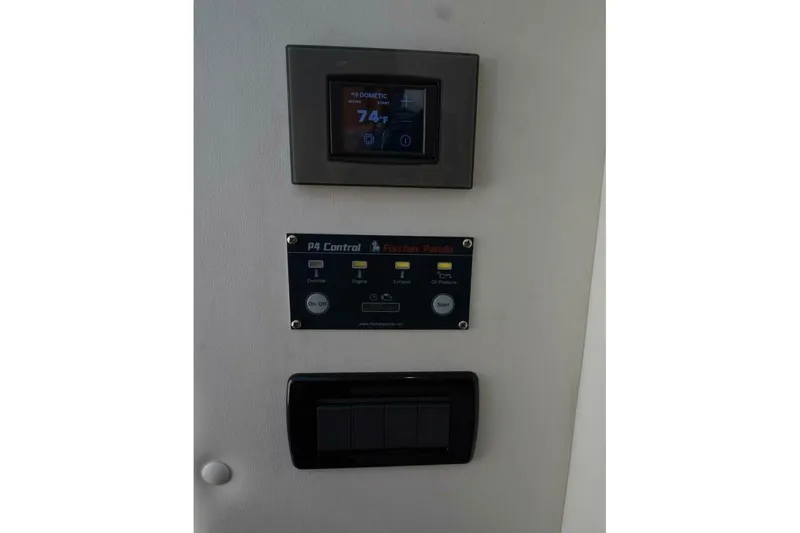 Slide: The Image of Control panel of 2020 Concept 44' Cuddy Cabin with digital display and switches. - 22