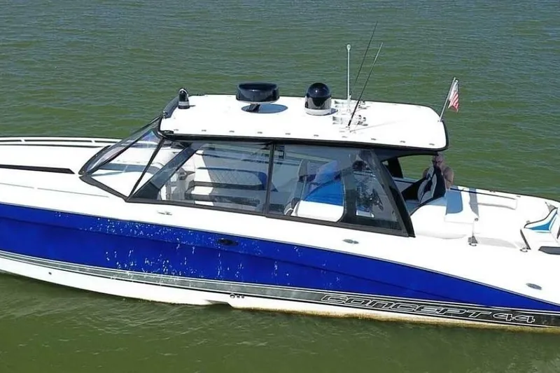 Slide: The Image of 2020 Concept 44' Cuddy Cabin boat on water, featuring sleek blue and white design. - 3