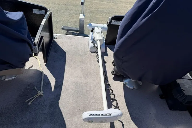 Slide: The Image of Covered seats and trolling motor on 2013 Premier 221 Explorer boat deck. - 12