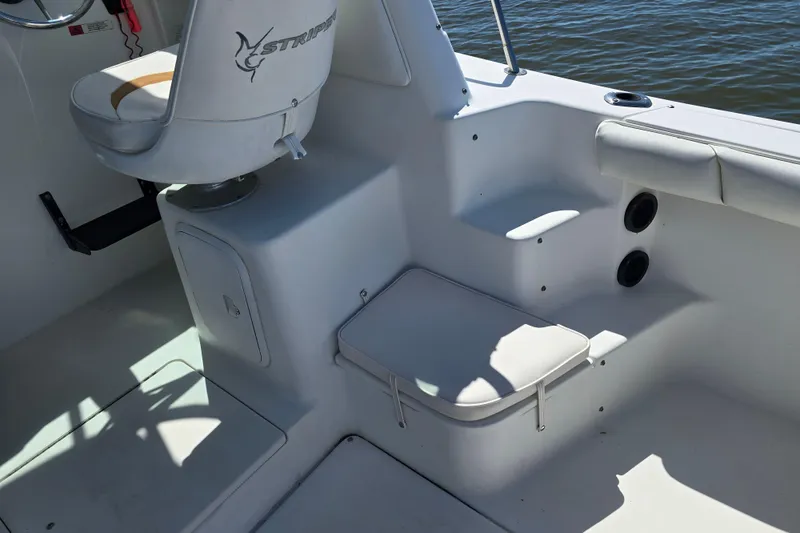 Slide: The Image of 2003 Seaswirl Striper 2301 Walkaround OB boat interior with seating and storage. - 17