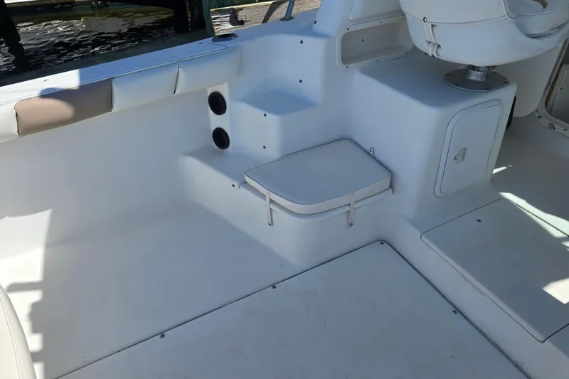 Slide: The Image of 2003 Seaswirl Striper 2301 Walkaround OB boat interior with seating and storage. - 20