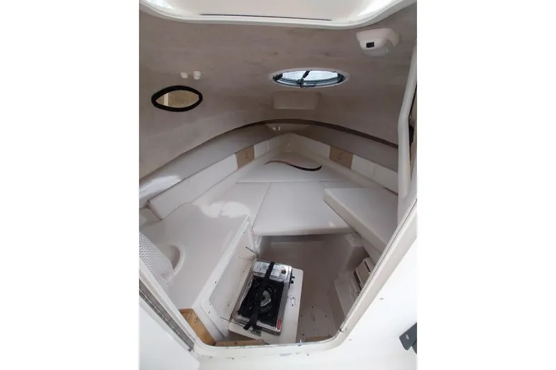 Slide: The Image of 2003 Seaswirl Striper 2301 Walkaround OB cabin interior with seating and storage. - 29
