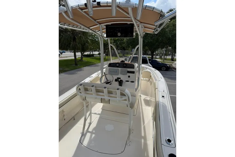 Slide: The Image of 2017 Pioneer 202 Islander boat interior with steering console and seating. - 10