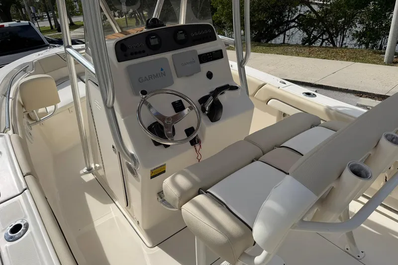 Slide: The Image of 2017 Pioneer 202 Islander boat interior with Garmin navigation system and steering wheel. - 13