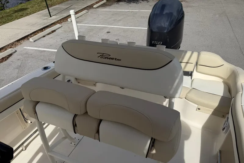 Slide: The Image of 2017 Pioneer 202 Islander boat interior with seating and outboard motor. - 15