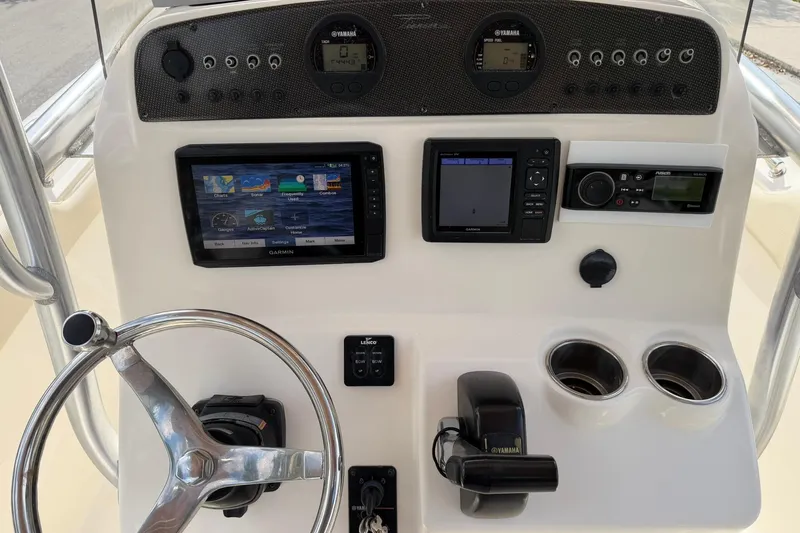 Slide: The Image of 2017 Pioneer 202 Islander boat dashboard with Garmin displays and Yamaha controls. - 17