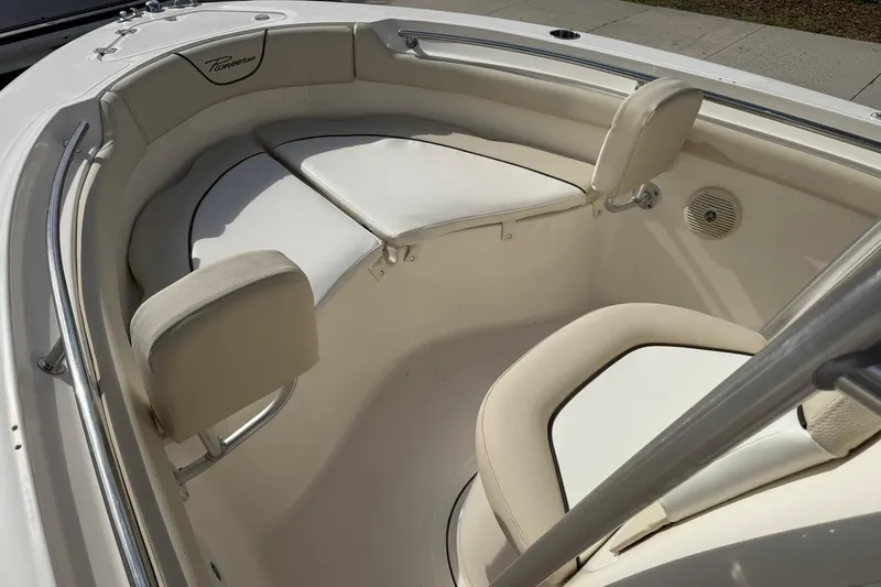 Slide: The Image of Interior of a 2017 Pioneer 202 Islander boat with cushioned seating. - 18