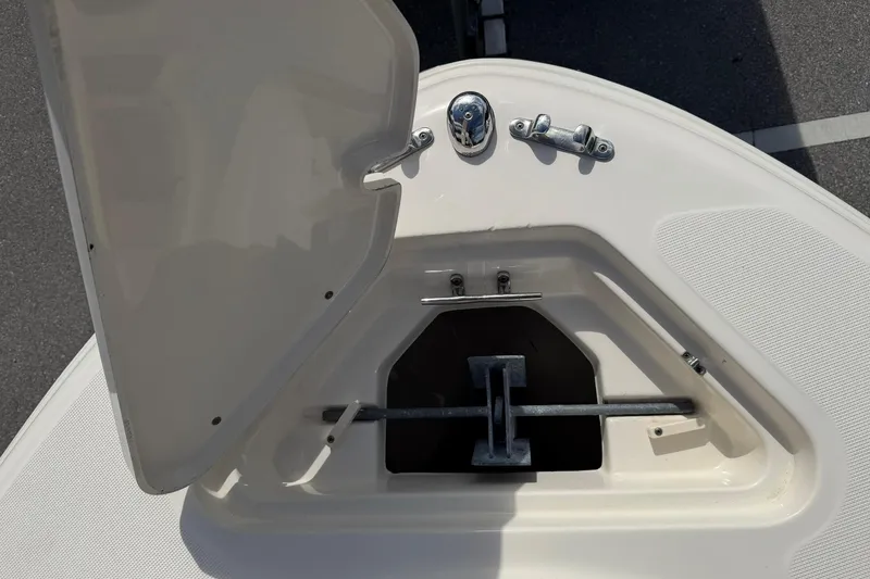 Slide: The Image of Open anchor compartment on a 2017 Pioneer 202 Islander boat. - 20