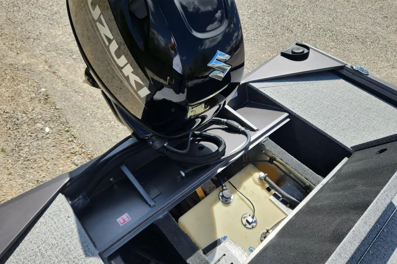 Slide: The Image of 2026 Smoker Craft Viper XR 175 Pro with Suzuki outboard motor, open engine compartment. - 10
