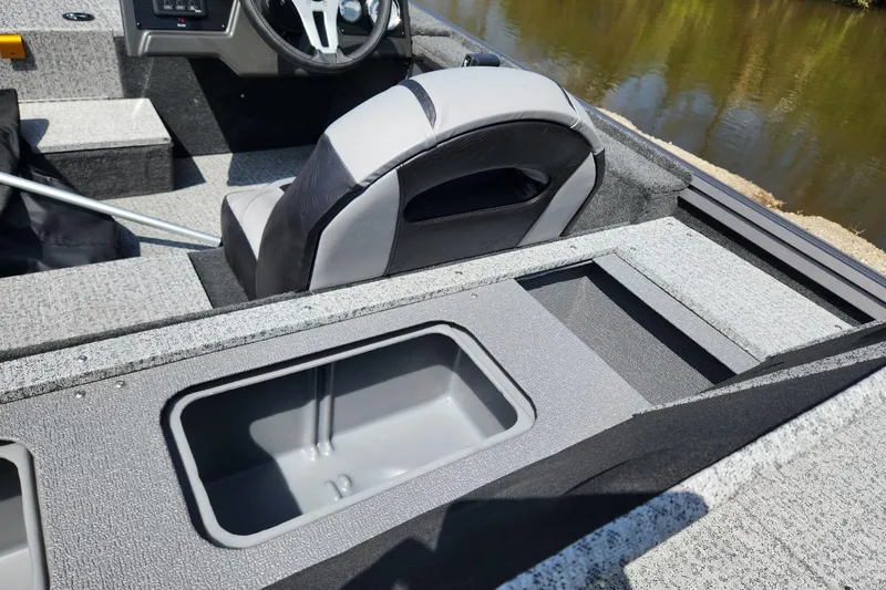 Slide: The Image of 2026 Smoker Craft Viper XR 175 Pro boat interior with seating and storage compartments. - 12