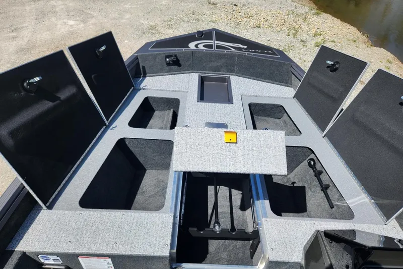 Slide: The Image of 2026 Smoker Craft Viper XR 175 Pro boat interior with open storage compartments. - 13