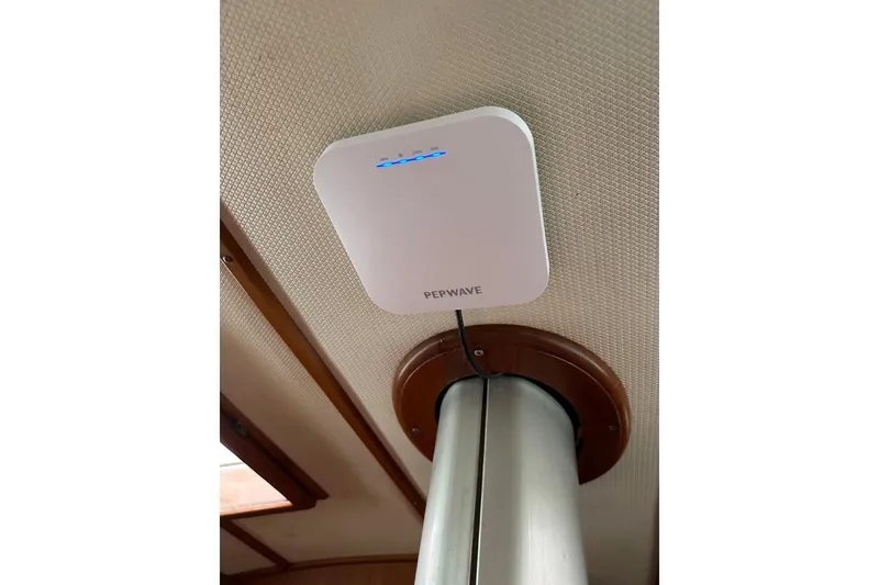 Slide: The Image of Pepwave device installed on a 1989 Hylas 44 yacht ceiling. - 13