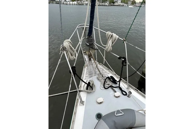 Slide: The Image of Bow of 1989 Hylas 44 sailboat with ropes and fittings on deck. - 2