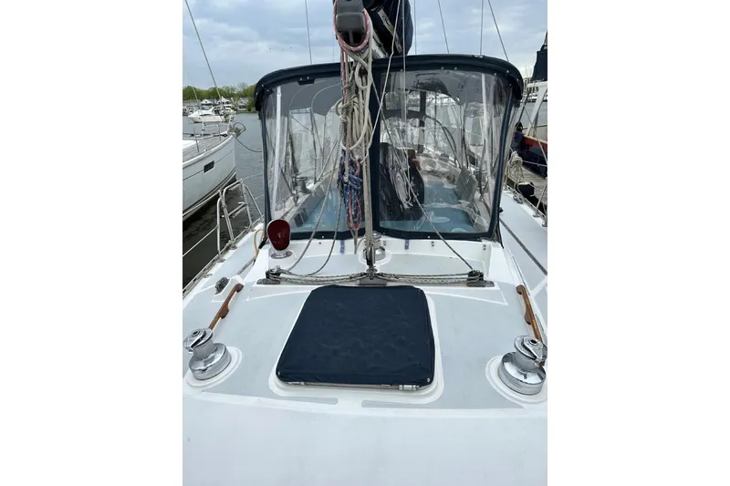 Slide: The Image of 1989 Hylas 44 sailboat deck with winches and cockpit enclosure. - 25