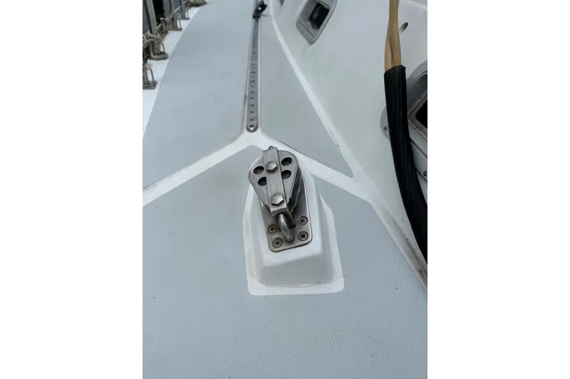 Slide: The Image of Deck hardware on a 1989 Hylas 44 sailboat, featuring a stainless steel fitting. - 29