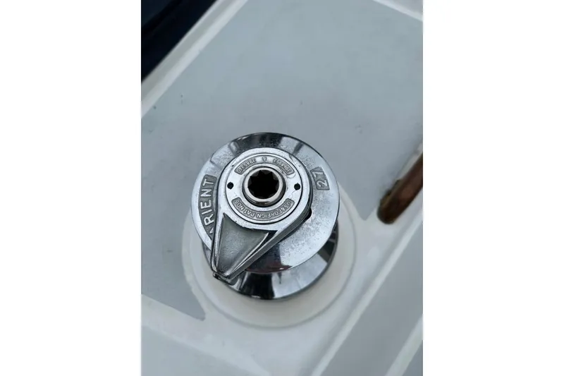 Slide: The Image of Close-up of a Hylas 44 sailboat winch, model year 1989, on a white deck. - 30