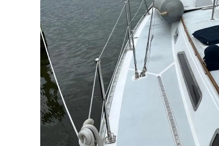 Slide: The Image of 1989 Hylas 44 sailboat docked, showcasing deck and rigging details. - 2