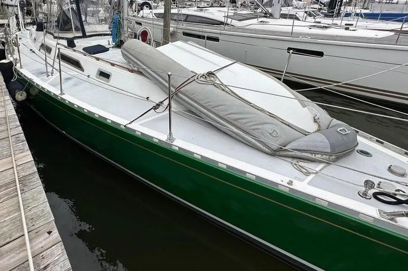 Slide: The Image of Sailboat docked in marina, 1989 Hylas 44 model, green hull, overcast sky. - 4