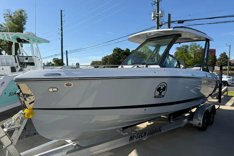 The Image of 2026 Monterey Elite 27 OB boat on trailer, displayed outdoors. - 0