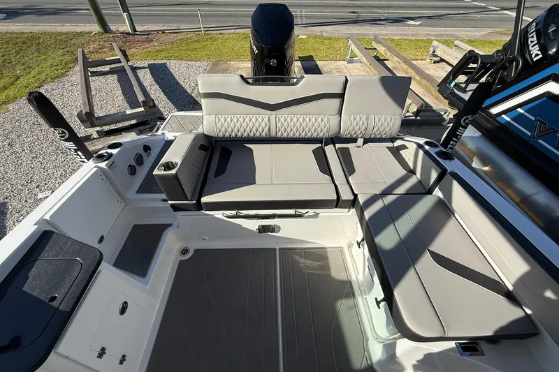 Slide: The Image of 2026 Monterey Elite 27 OB boat interior with sleek seating and modern design. - 10