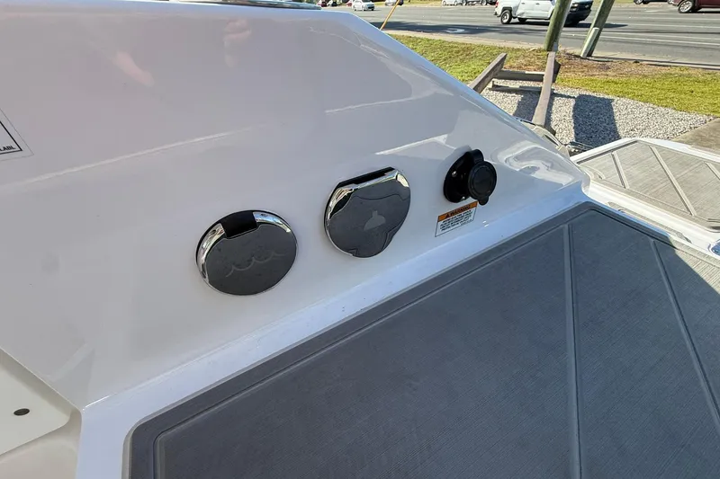 Slide: The Image of 2026 Monterey Elite 27 OB boat deck with chrome fittings and textured flooring. - 14