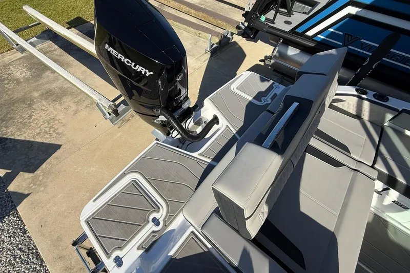 Slide: The Image of 2026 Monterey Elite 27 OB boat with Mercury outboard engine, featuring sleek seating and deck design. - 15