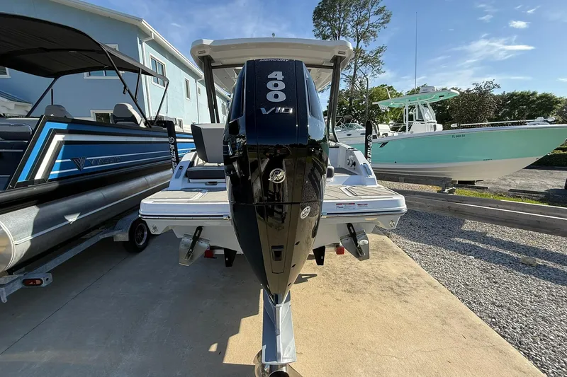 Slide: The Image of 2026 Monterey Elite 27 OB boat with powerful 400 V10 engine, docked outdoors. - 4