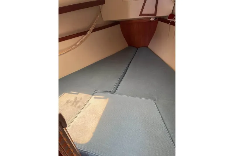 Slide: The Image of Interior cabin of a 1988 Catalina 30 MkII sailboat with blue cushions. - 4