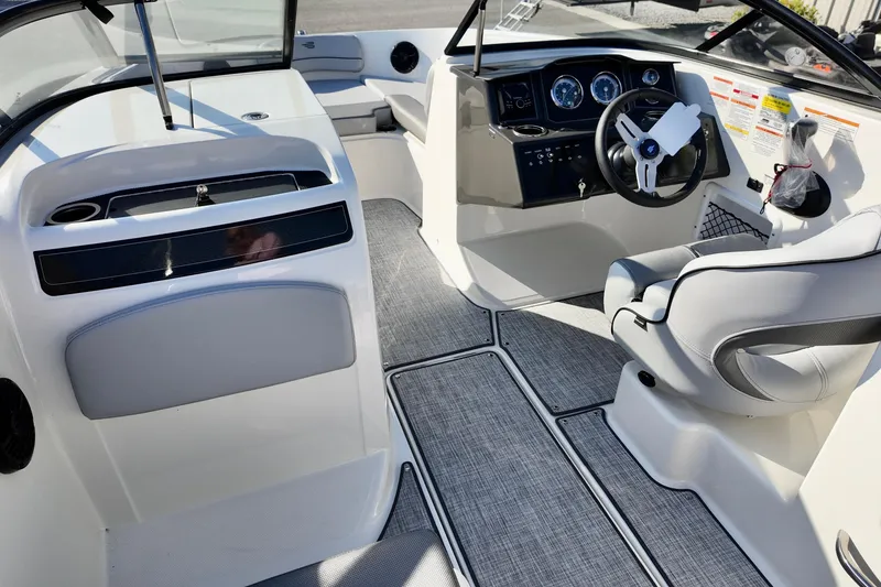 Slide: The Image of 2026 Bayliner VR6 Bowrider OB interior with modern dashboard and seating. - 15