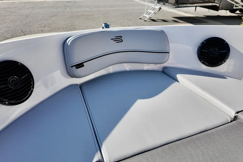 Slide: The Image of 2026 Bayliner VR6 Bowrider OB interior with cushioned seating and built-in speakers. - 20