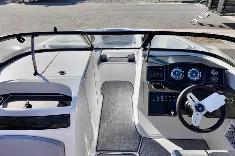 Slide: The Image of 2026 Bayliner VR6 Bowrider OB dashboard with steering wheel and instrument panel. - 21