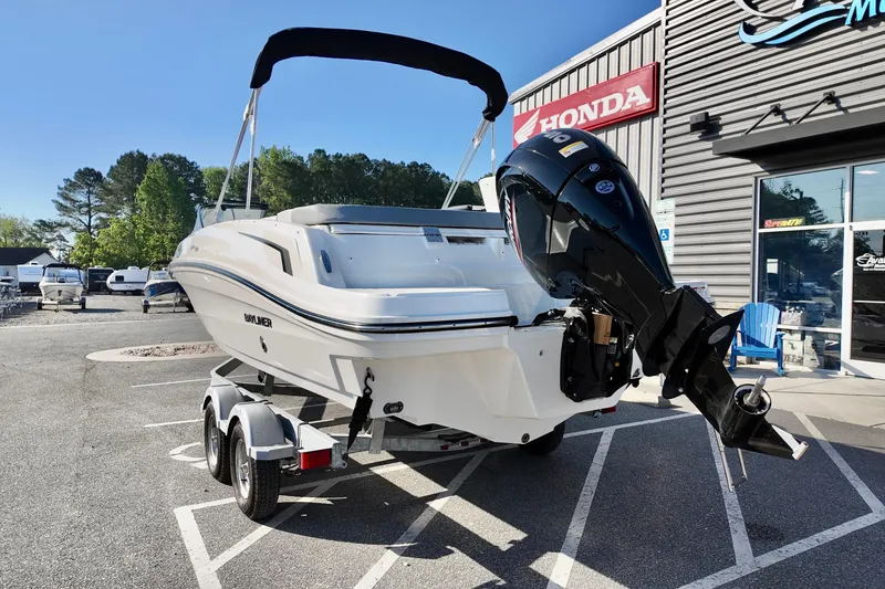 Slide: The Image of 2026 Bayliner VR6 Bowrider OB on trailer, parked outside dealership. - 8
