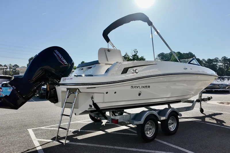 Slide: The Image of 2026 Bayliner VR6 Bowrider OB on trailer, featuring sleek design and powerful outboard motor. - 9