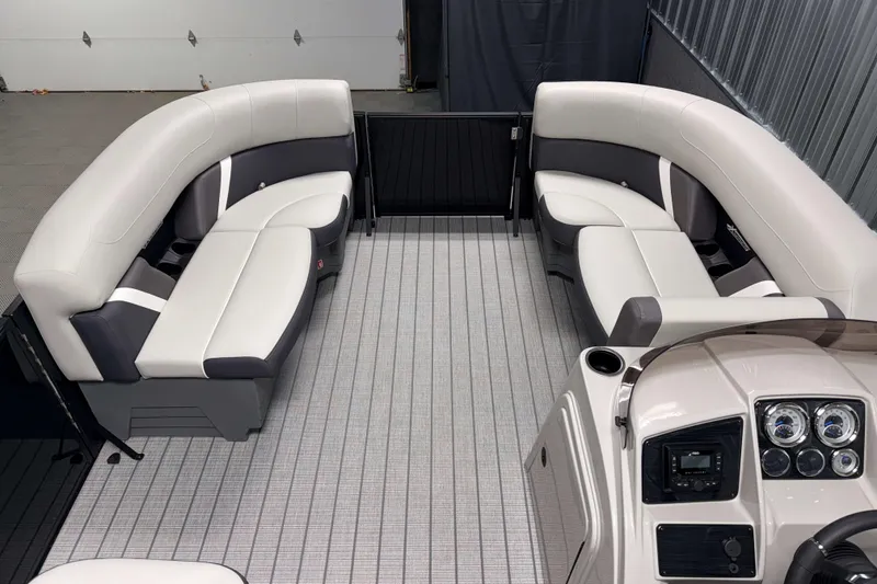 Slide: The Image of 2026 Sylvan Mirage X1 LZ DH pontoon boat interior with plush seating and modern dashboard. - 14