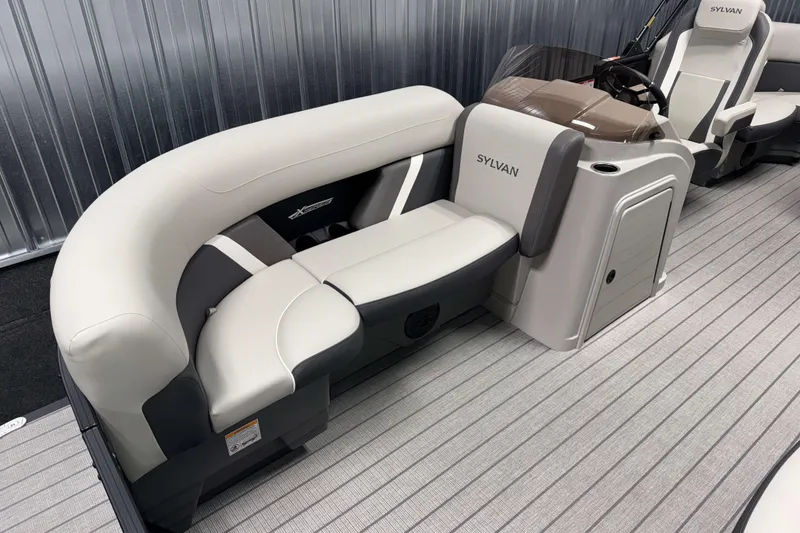 Slide: The Image of 2026 Sylvan Mirage X1 LZ DH boat interior with sleek seating and modern design. - 16