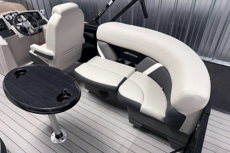 Slide: The Image of Luxurious interior of 2026 Sylvan Mirage X1 LZ DH pontoon boat with plush seating and table. - 3
