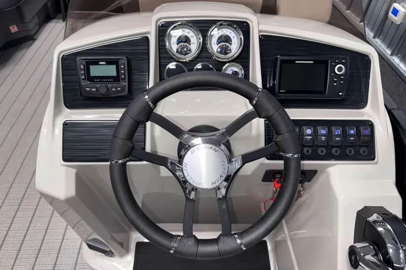 Slide: The Image of Steering console of 2026 Sylvan Mirage X1 LZ DH boat with modern controls and gauges. - 8
