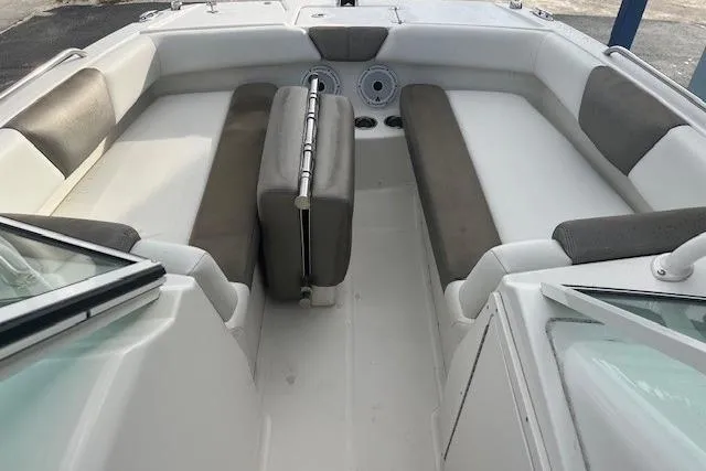 Slide: The Image of 2022 World Cat 230 SD boat interior with cushioned seating and modern design. - 3