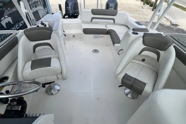 Slide: The Image of Interior of 2022 World Cat 230 SD boat with white and gray seating. - 5