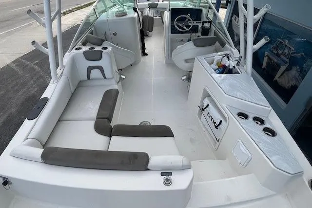 Slide: The Image of 2022 World Cat 230 SD boat interior with seating and helm, showcasing modern design. - 6