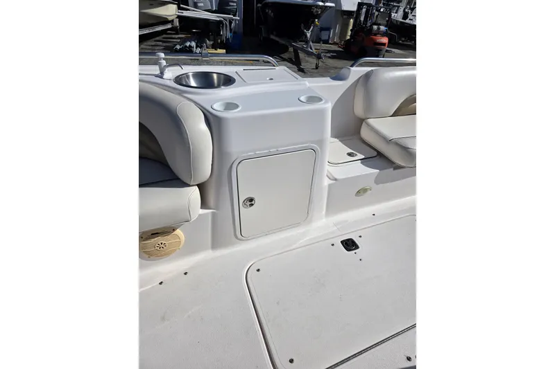 Slide: The Image of 2004 Hurricane FunDeck GS 232 OB boat interior with seating and storage compartment. - 8