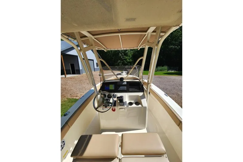Slide: The Image of 2022 Scout 215 XSF boat interior with steering wheel and dashboard. - 3
