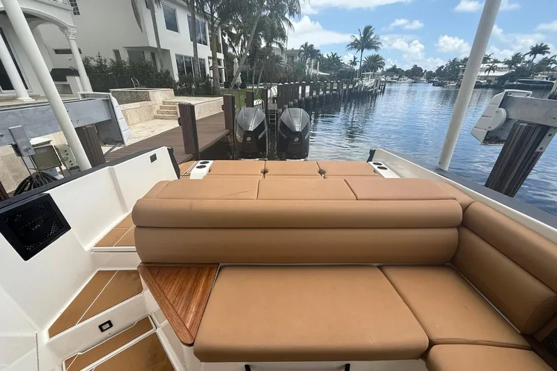 Slide: The Image of Luxurious seating on 2022 Aviara AV32 OB boat with scenic waterfront view. - 11