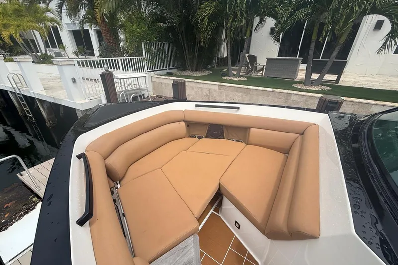 Slide: The Image of 2022 Aviara AV32 OB boat docked by waterfront luxury home with pool. - 13