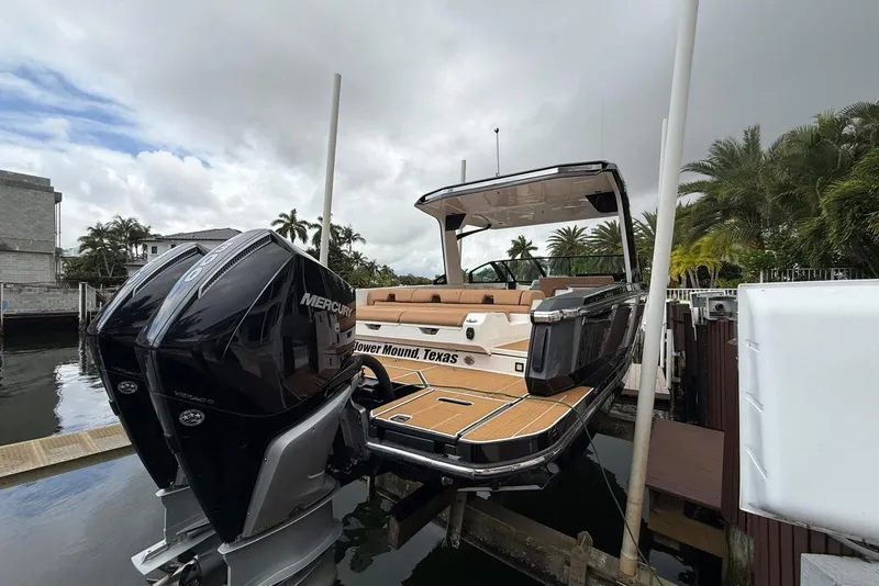 Slide: The Image of Control panel of 2022 Aviara AV32 OB boat with throttle and joystick. - 16