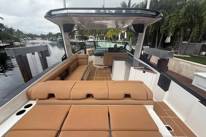 Slide: The Image of Luxurious 2022 Aviara AV32 OB boat interior with tan seating and waterfront view. - 4