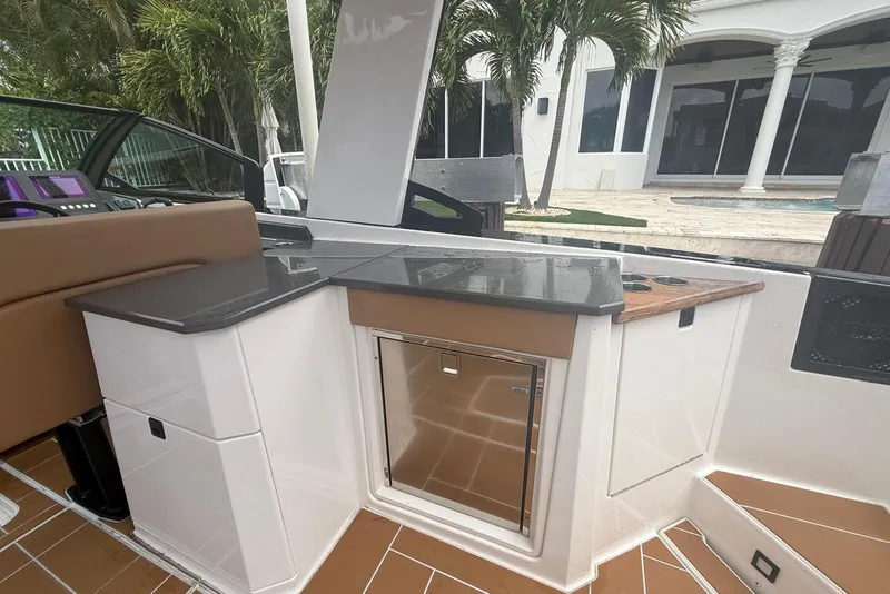 Slide: The Image of Cockpit of 2022 Aviara AV32 OB boat with modern controls and steering wheel. - 8